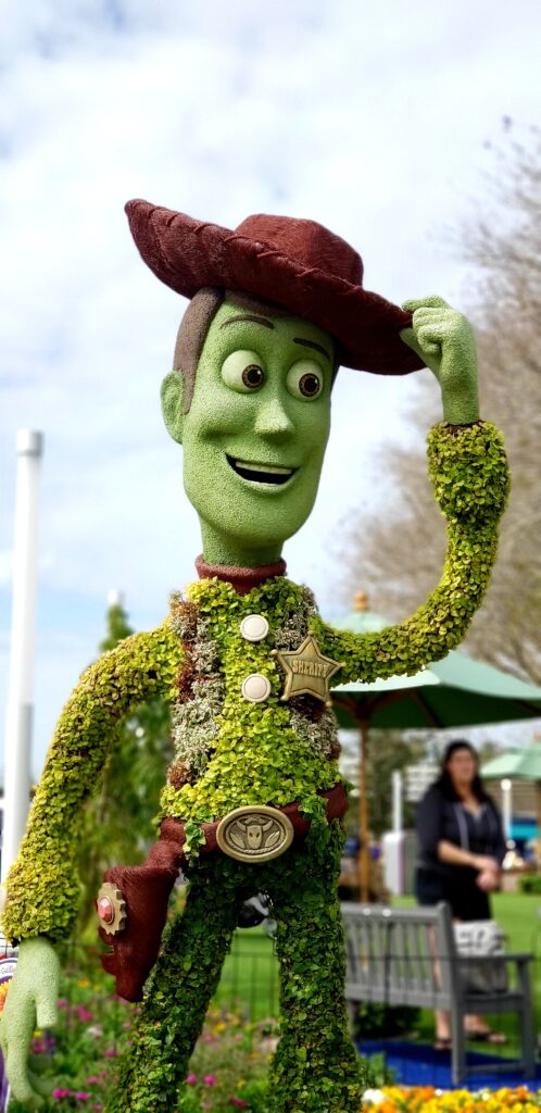 topiary of woody from toy story tipping his hat
