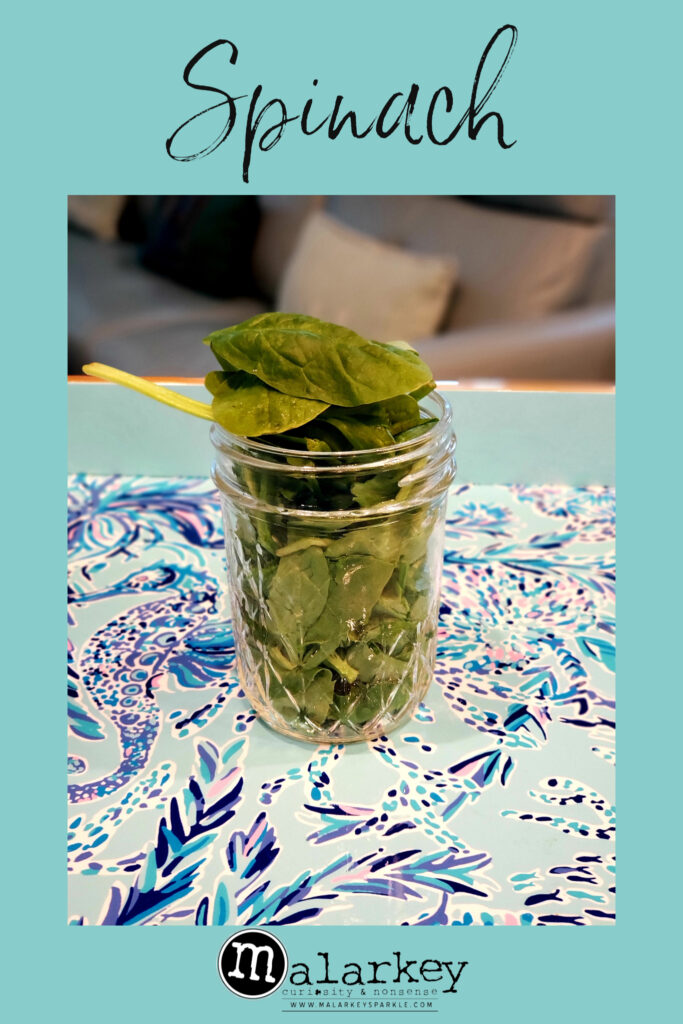 spinach in a jar on a plate