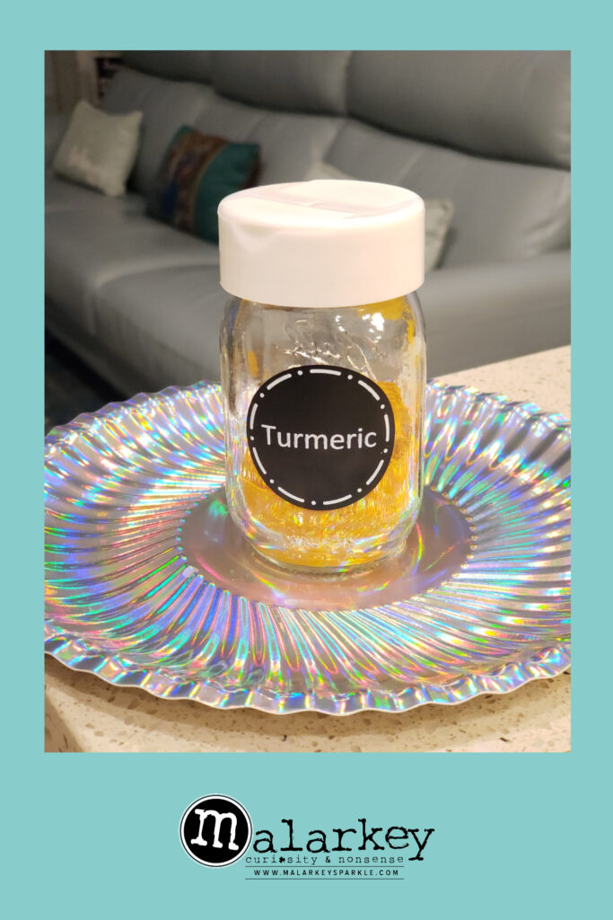 turmeric in a jar on a plate