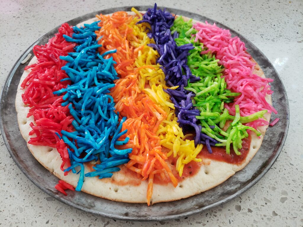 rainbow pizza unbaked - 7 colors of cheese