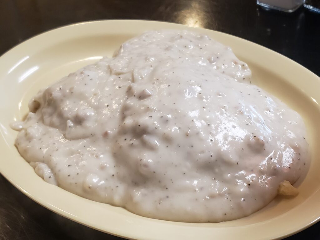 plate with biscuits and gravy