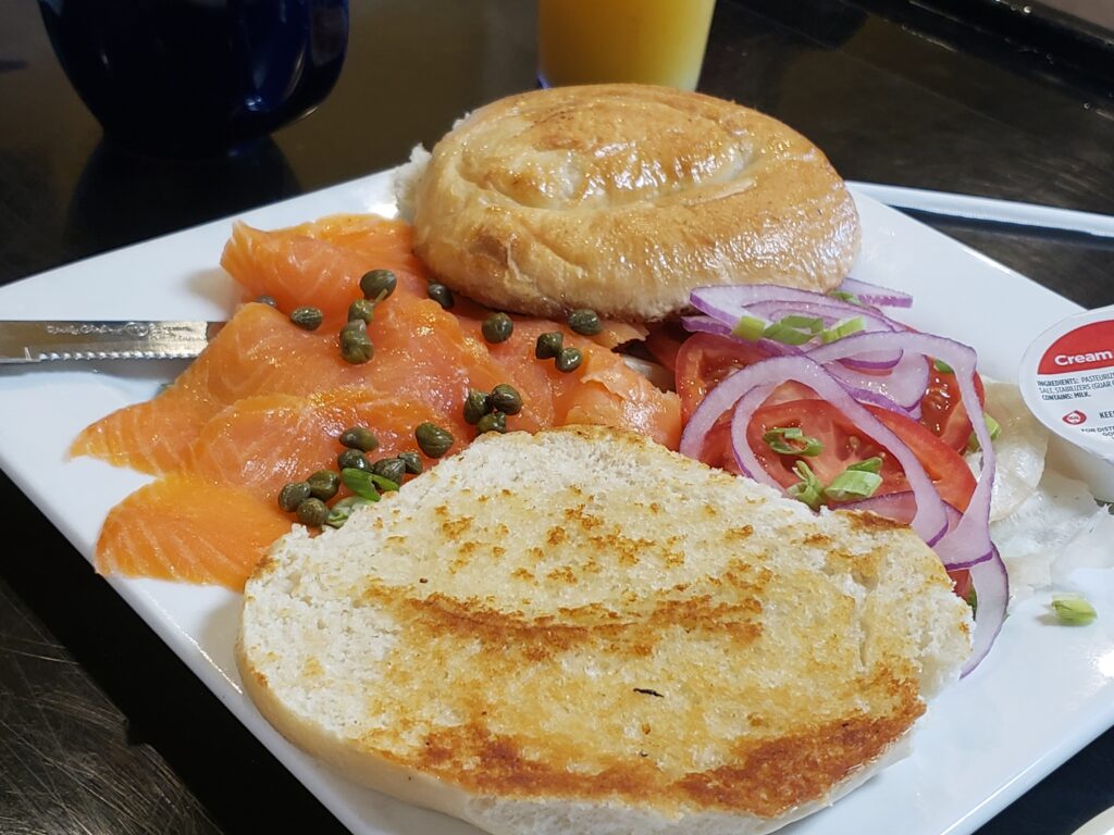 plate with lox, tomato, onion and bagel