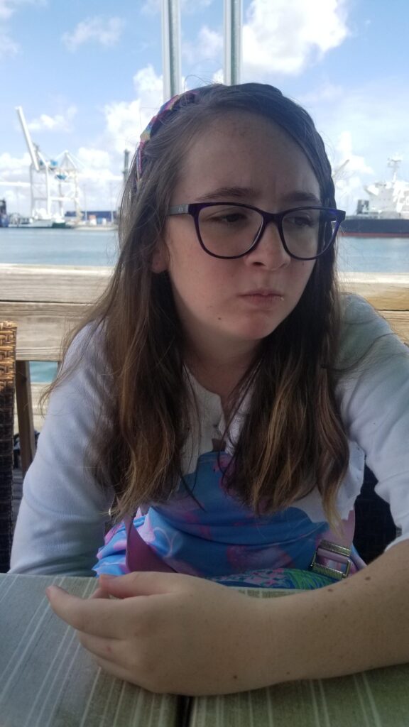 saoirse making a face after eating her first steamed oyster