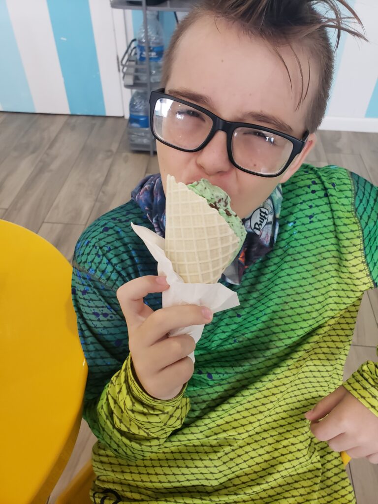 a boy eating an ice cream
