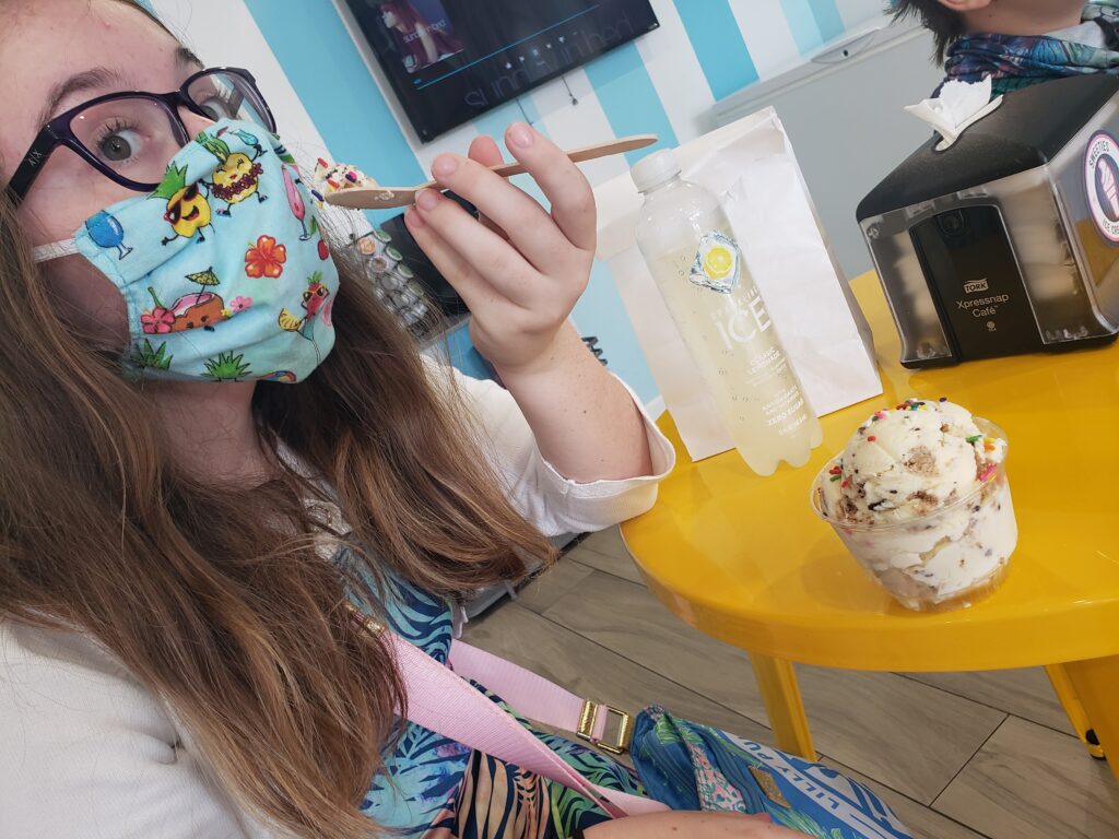 saoirse eating ice cream with a mask on