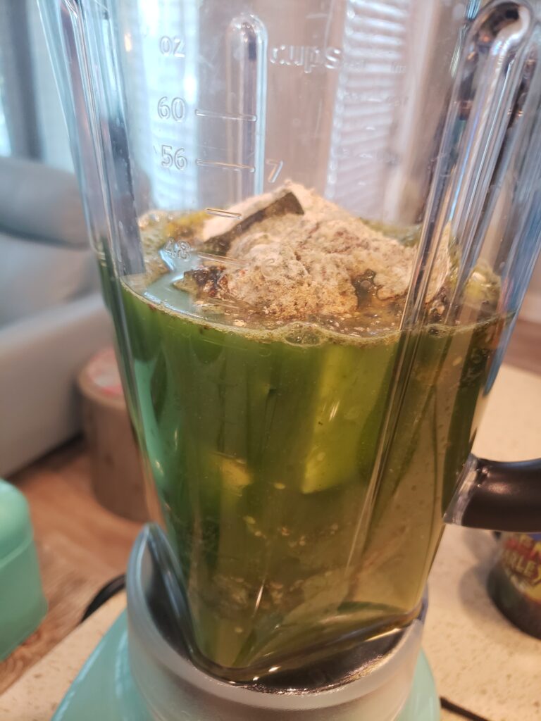 blender with juice inside and powers
