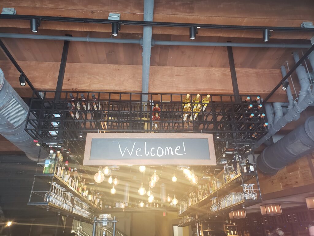 welcome sign at wine bar george
