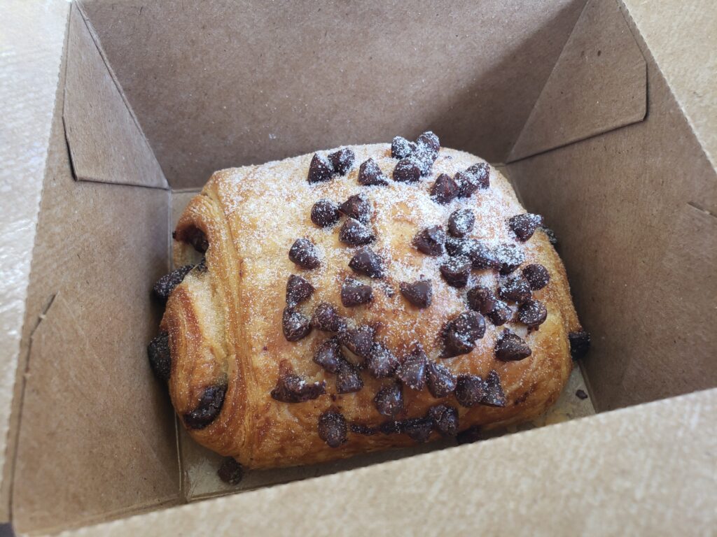 chocolate croissant in a brown box