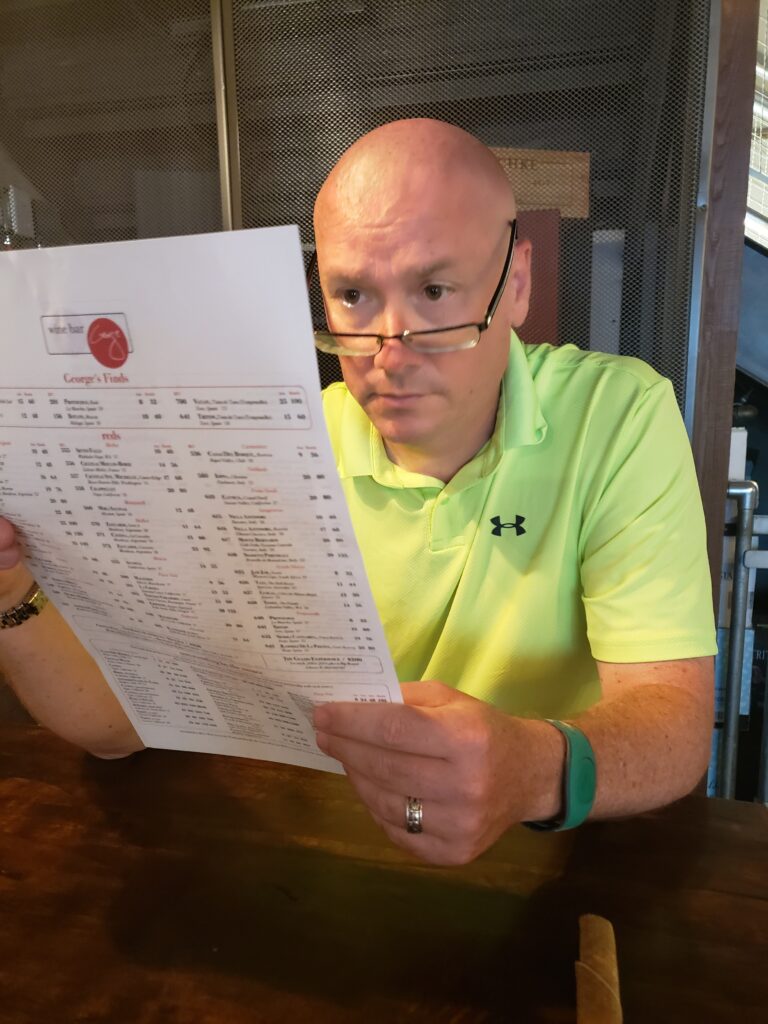 mark looking at menu at wine bar george