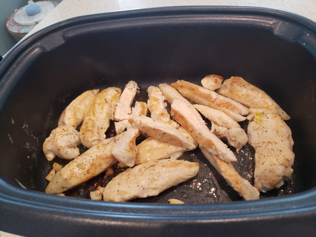 chicken in a crockpot sliced