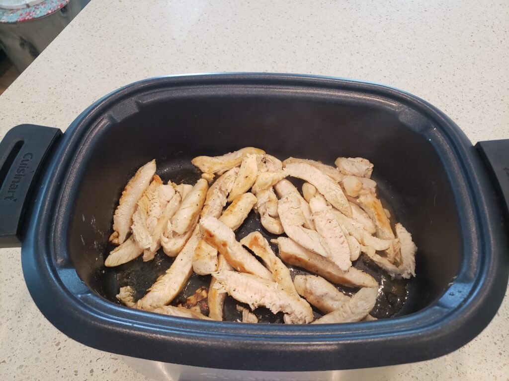 chicken in a crockpot sliced