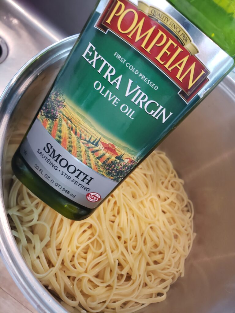 linguine in a pot with extra virgina olive oil it over it