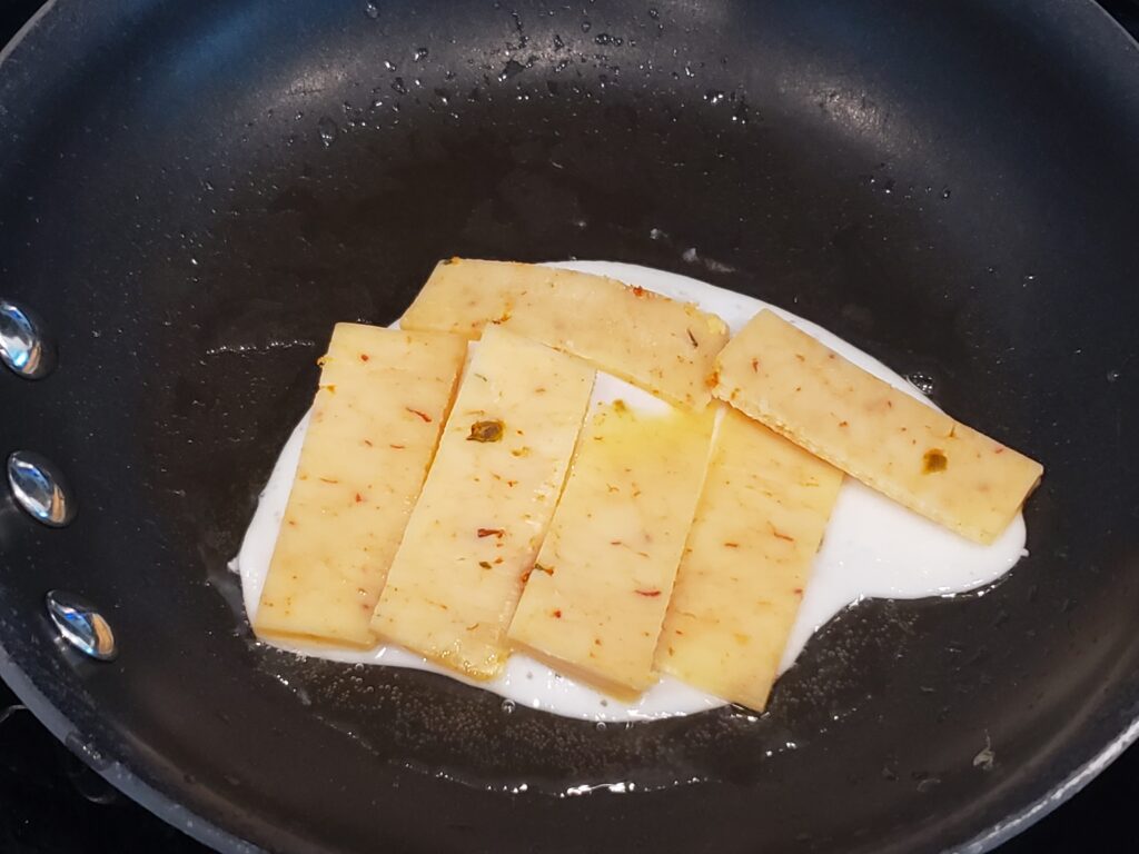 egg and cheese in a pan