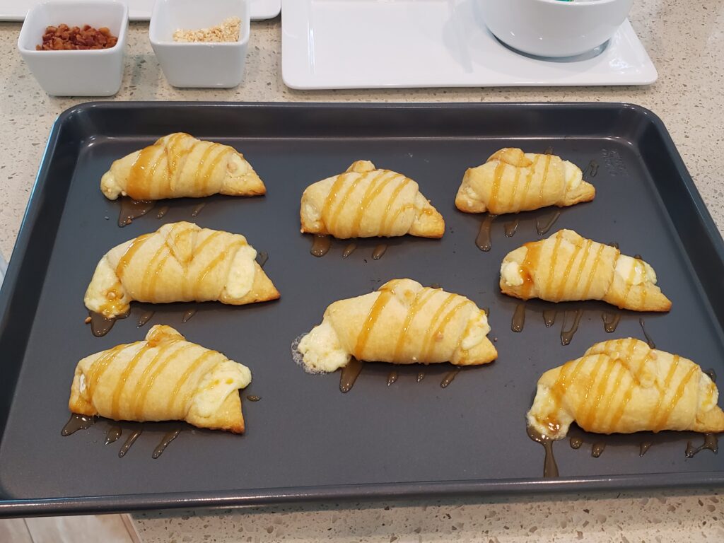 crescent rolls on a pan with caramel