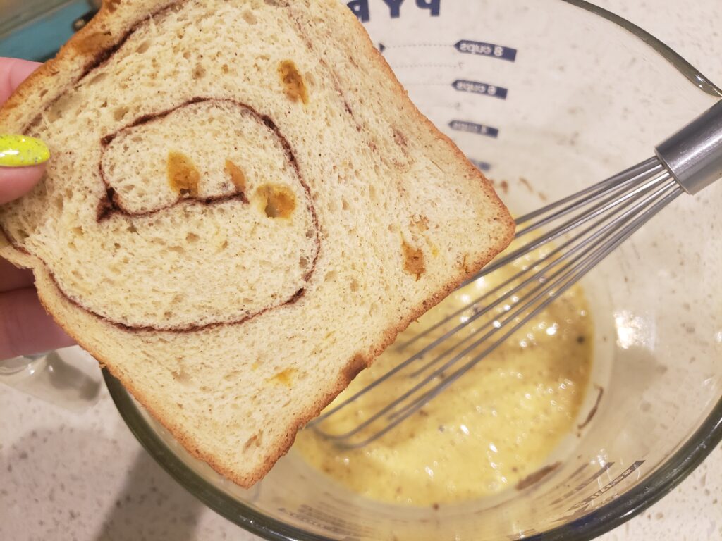 egg batter with pumpkin bread above it