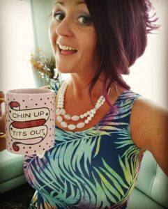 woman holding coffee cup with a smile - How to make a pumpkin dump cake in 5 minutes