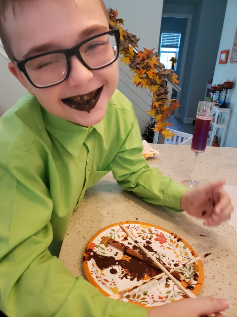 the boy with chocolate over his mouth from the epic chocolate fuontain