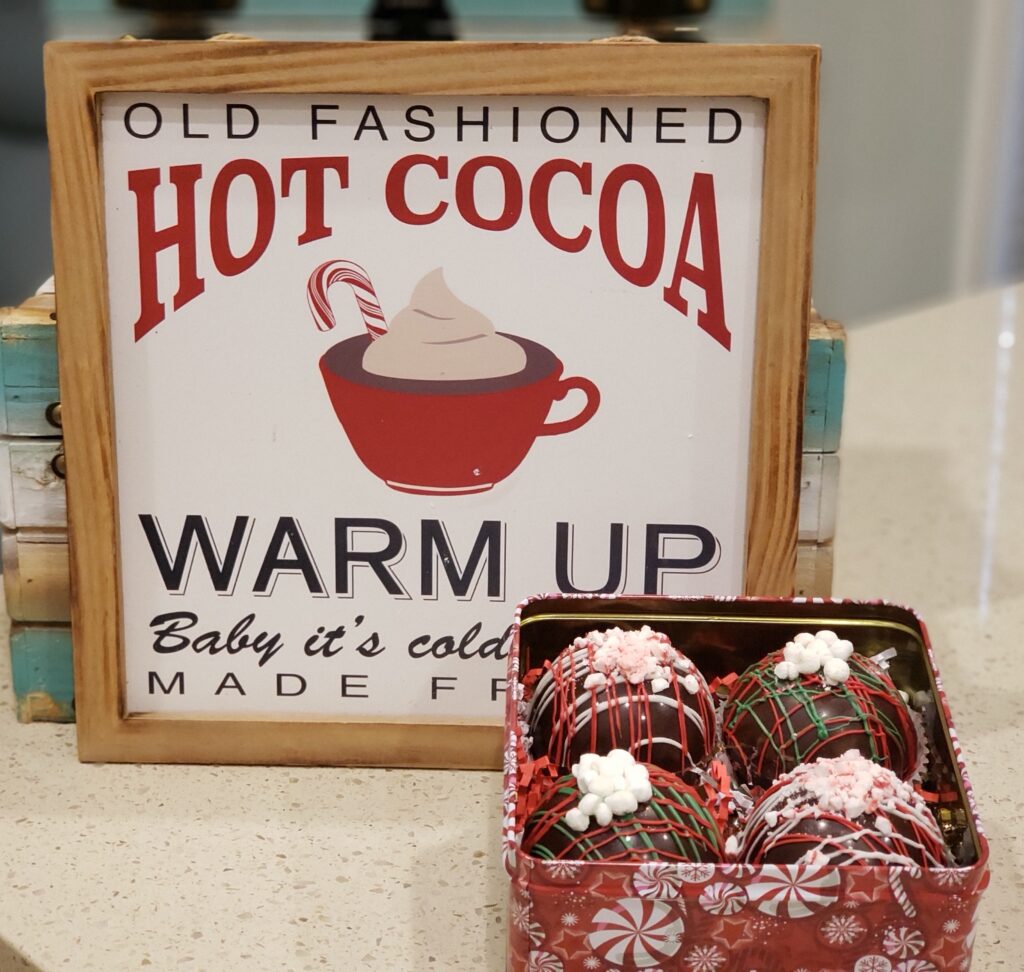 hot cocoa bombs - warm up sign with bombs