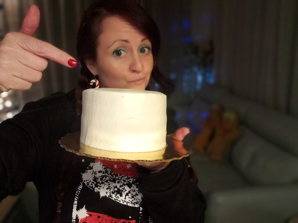 woman pointing at cake for the Winter Wonderland Cake - 3 easy steps