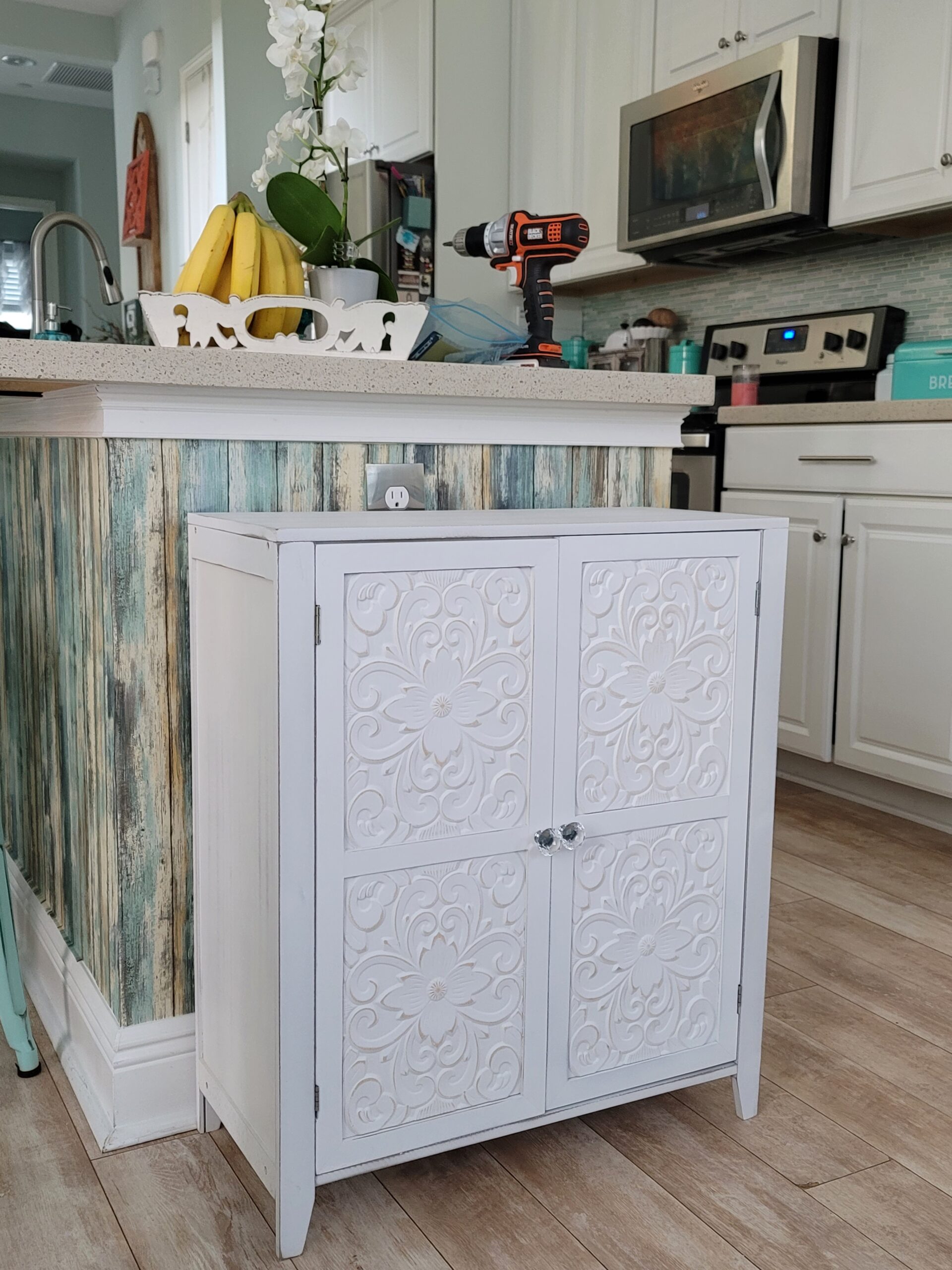 new white cabinet with carved doors
