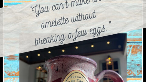 plate with omlette and a cup of coffee that says broken egg cafe