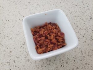 bacon bites in the white dish