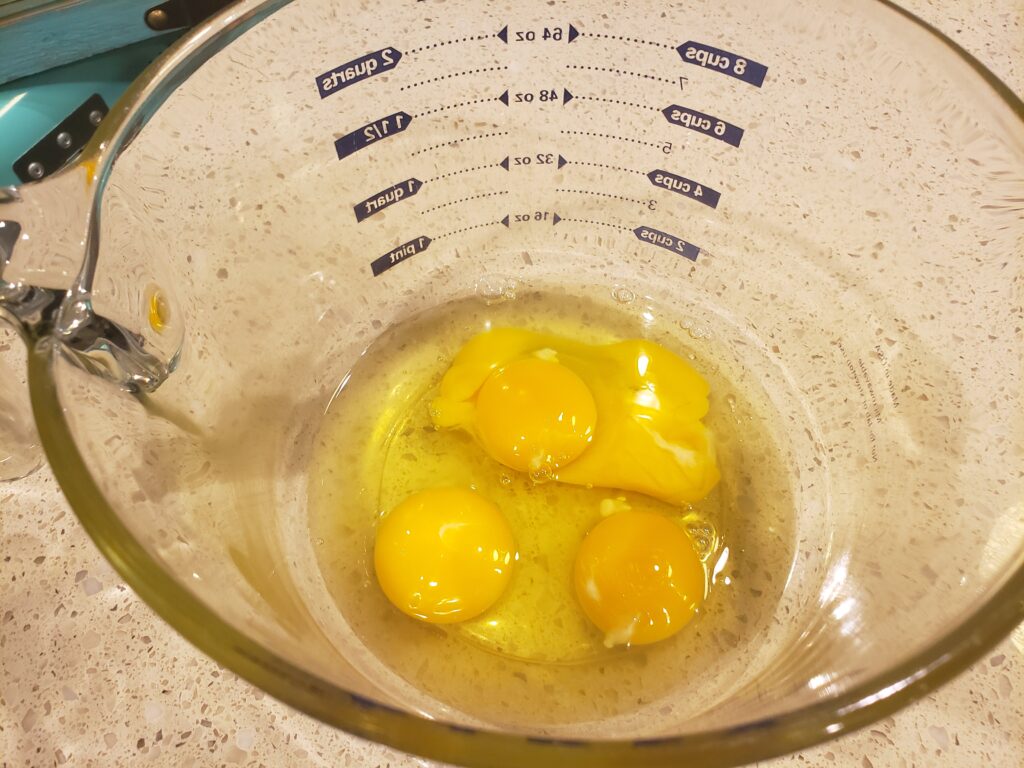 eggs cracked but not beaten in a bowl