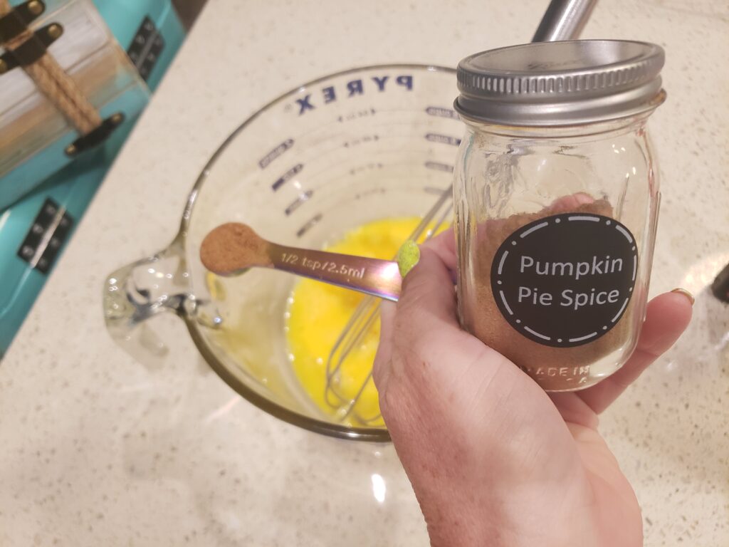 egg batter with pumpkin spice above it
