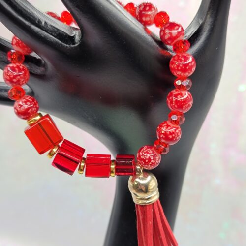 red bracelet with tassel