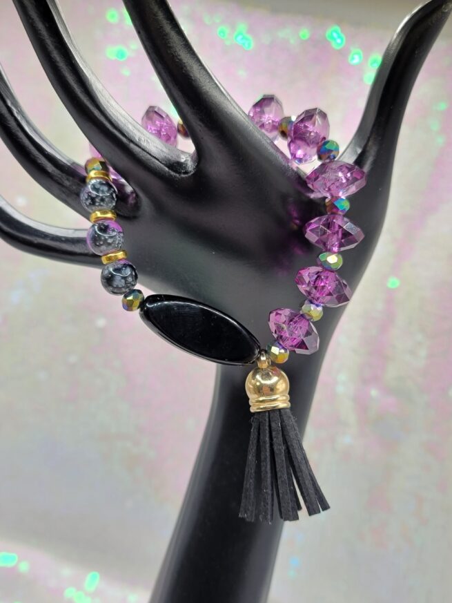 purple bracelet with black tassel