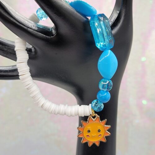 white and blue bracelet with sunray