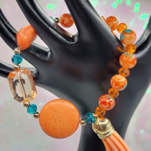 orange bracelet with tassel