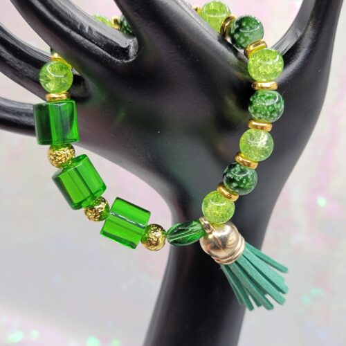 green bracelet with tassel