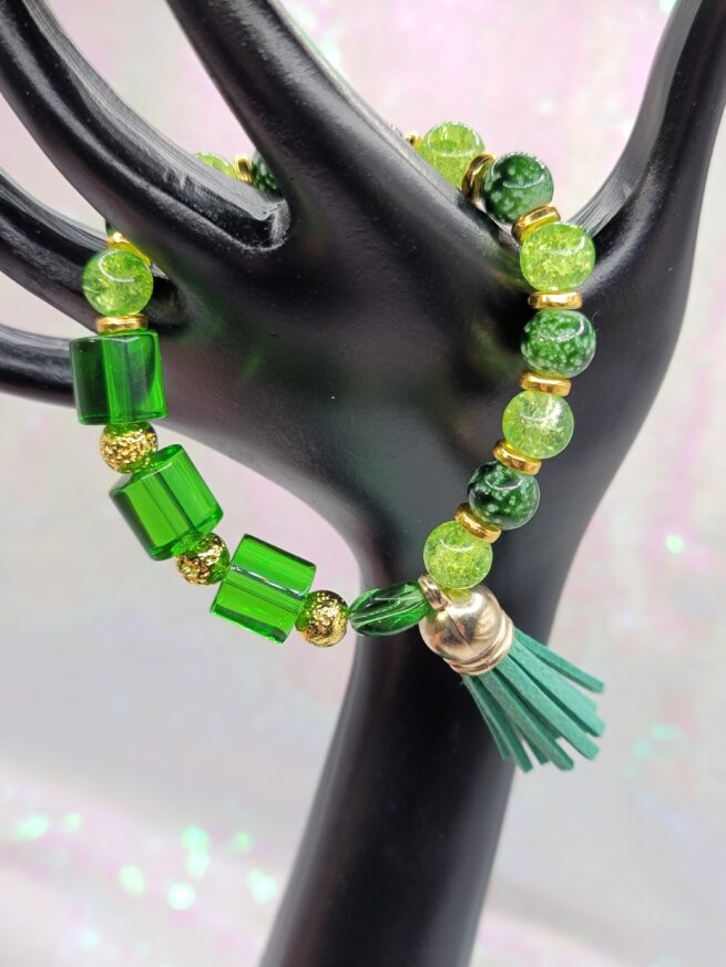 green bracelet with tassel