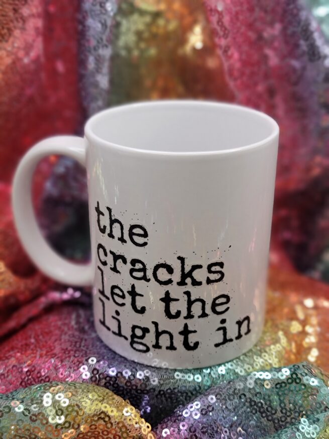the cracks let the light in coffee cup