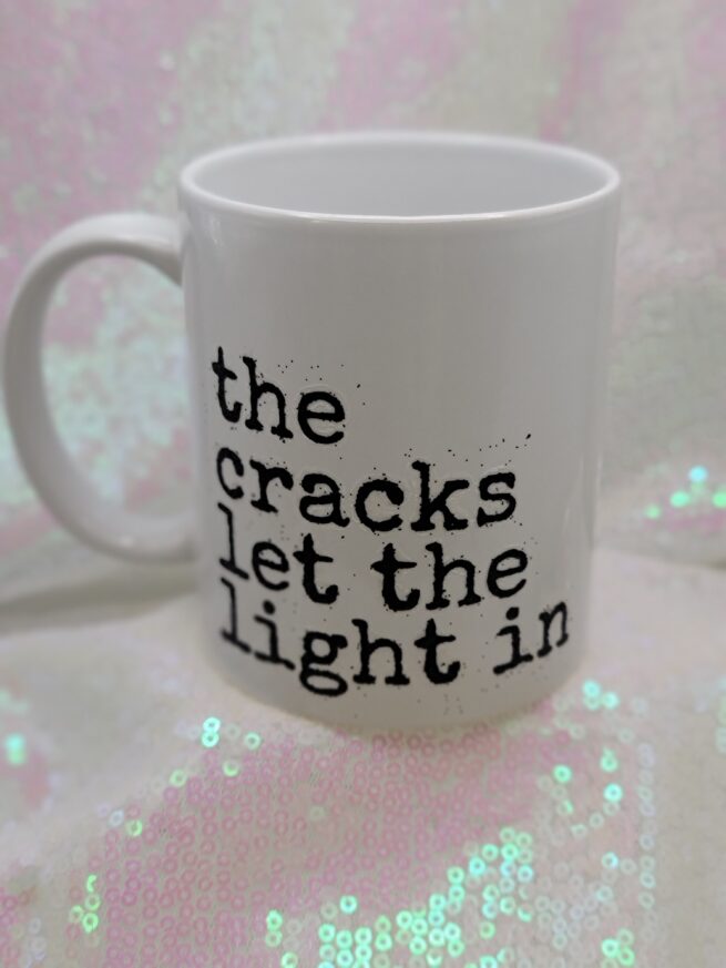 the cracks let the light in coffee cup
