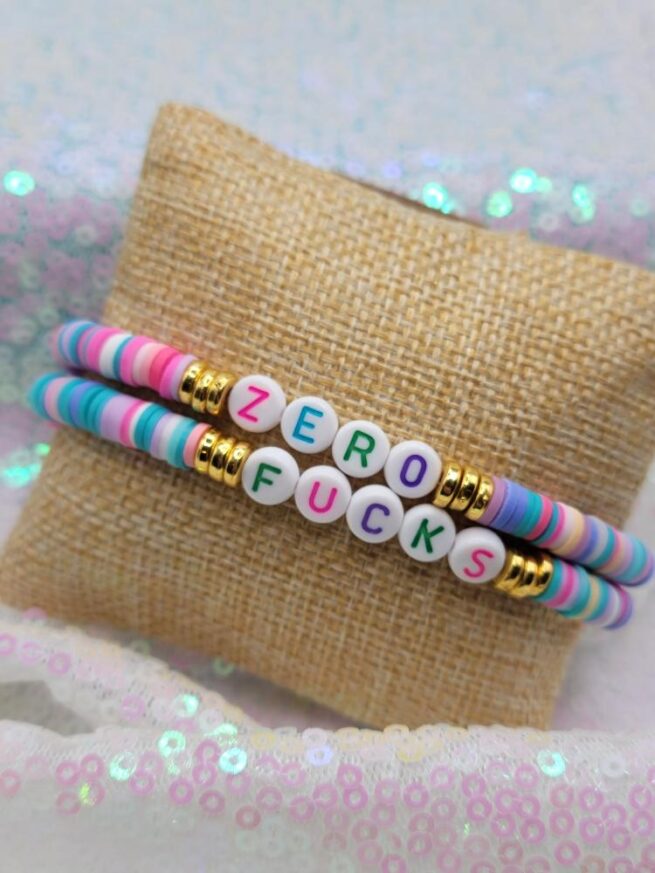 rainbow zero fucks bracelet stack with gold