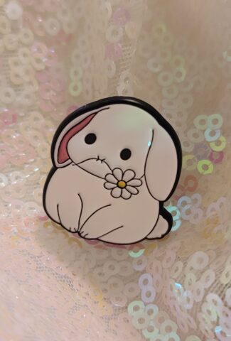 bunny with a flower in his mouth pin