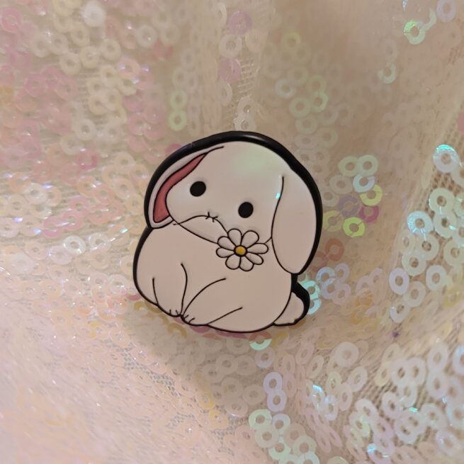 bunny with a flower in his mouth pin